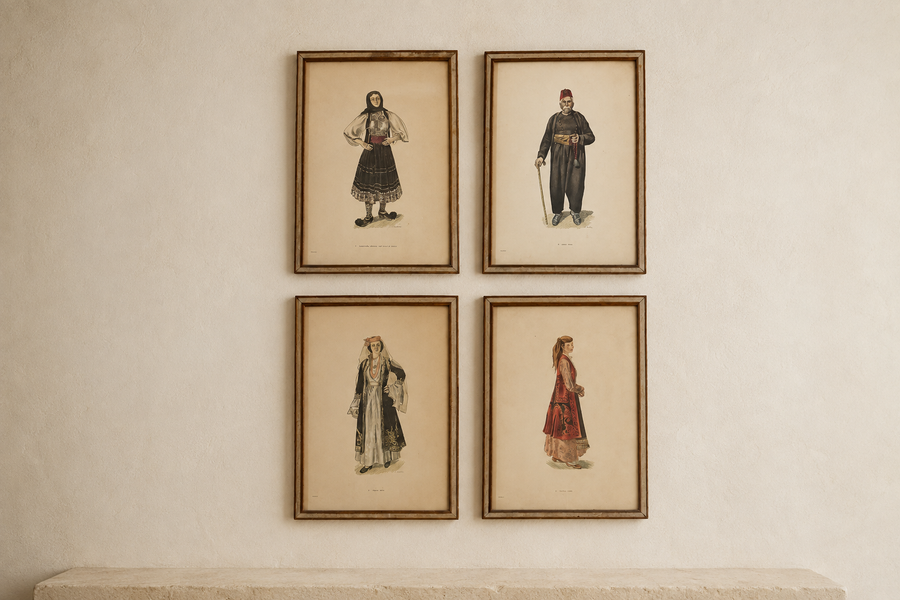 Four vintage framed A. Tassos prints of Greek regional dress on a gallery wall