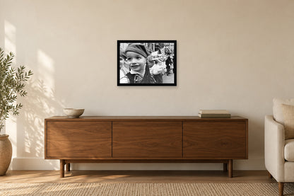 A Young Parade Participant in a black frame, shown in a home setting — room visualization