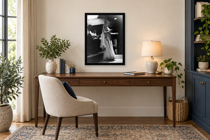 A Night Out in a black frame, shown in an office setting — room visualization