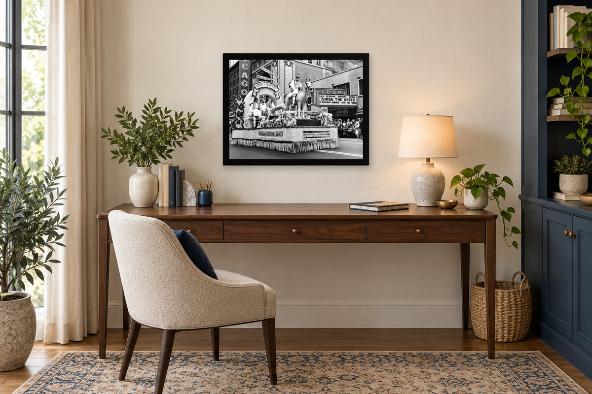 Greek Culture on the Marquee in a black frame, shown in an office setting — room visualization