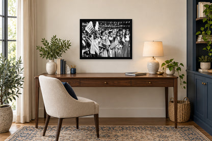 Two Flags, One Community in a black frame, shown in an office setting — room visualization