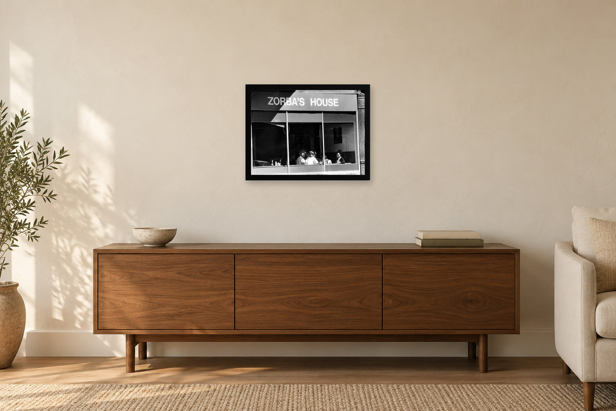 Zorba’s House Storefront in a black frame, shown in a home setting — room visualization