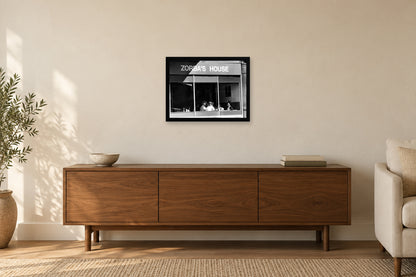 Zorba’s House Storefront in a black frame, shown in a home setting — room visualization