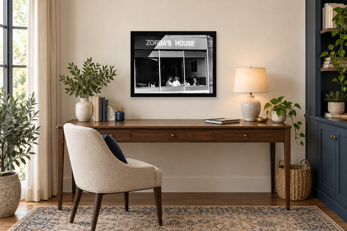 Zorba’s House Storefront in a black frame, shown in an office setting — room visualization
