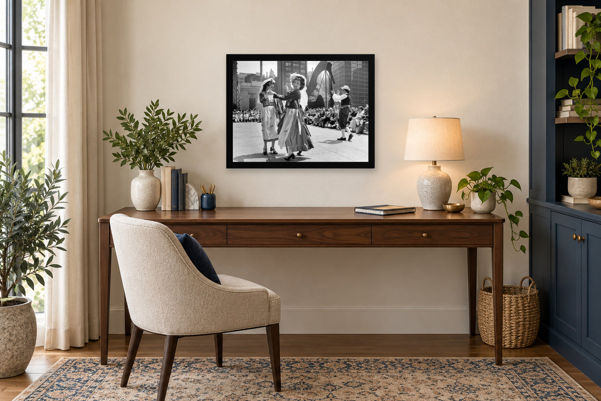 Dancing in the City Plaza in a black frame, shown in an office setting — room visualization
