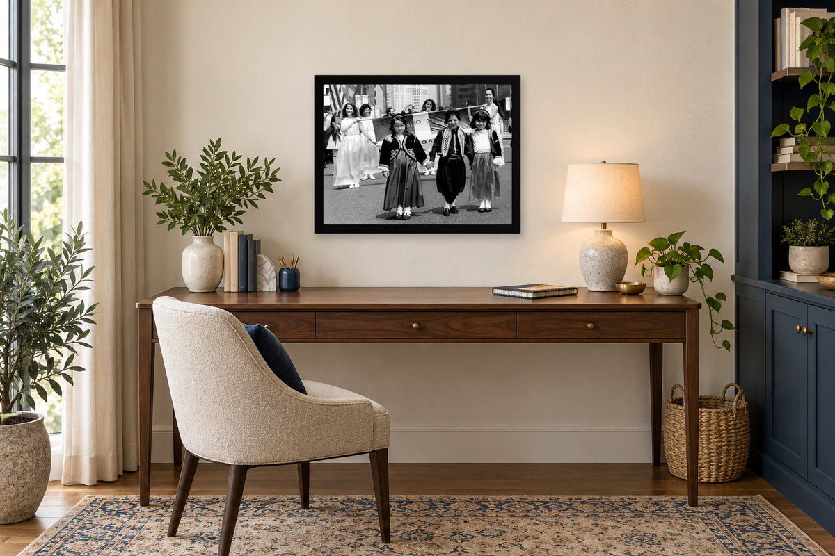 Children Lead the Procession in a black frame, shown in an office setting — room visualization