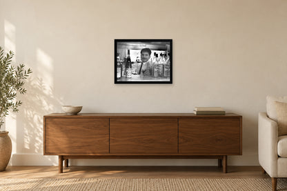 Pouring a Glass Behind the Counter in a black frame, shown in a home setting — room visualization