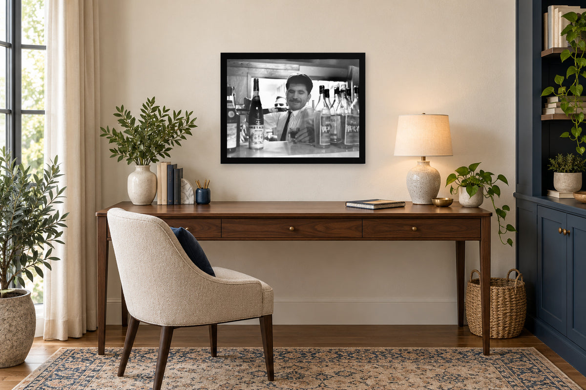 Pouring a Glass Behind the Counter in a black frame, shown in an office setting — room visualization