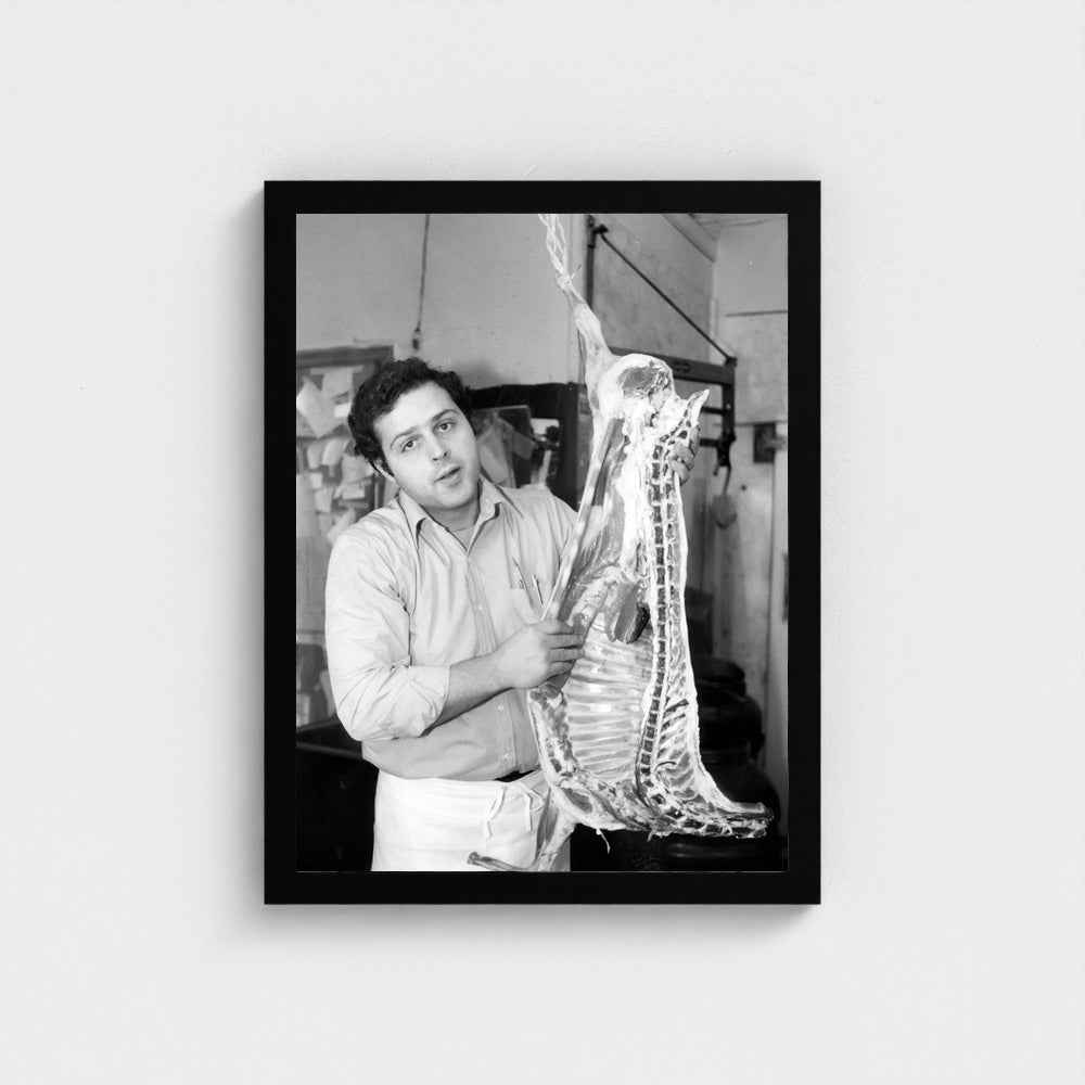 At the Butcher’s Counter — 12 × 16 inch black framed print