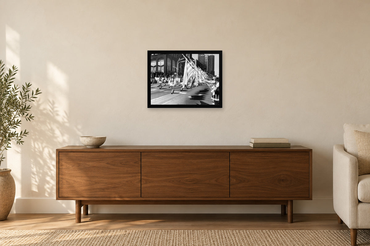 Flags along the Parade Route in a black frame, shown in a home setting — room visualization
