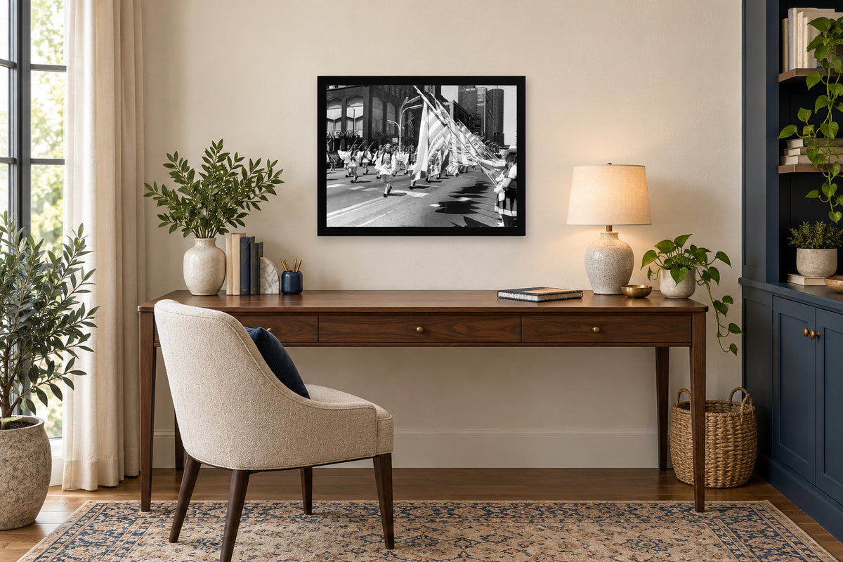 Flags along the Parade Route in a black frame, shown in an office setting — room visualization