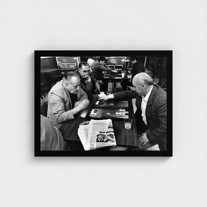 A Game at the Coffeehouse — 12 × 16 inch black framed print