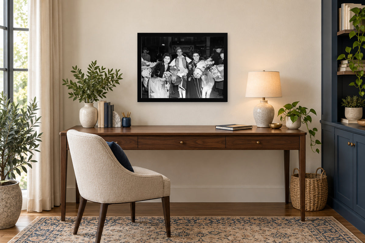 Flowers at a Community Celebration in a black frame, shown in an office setting — room visualization