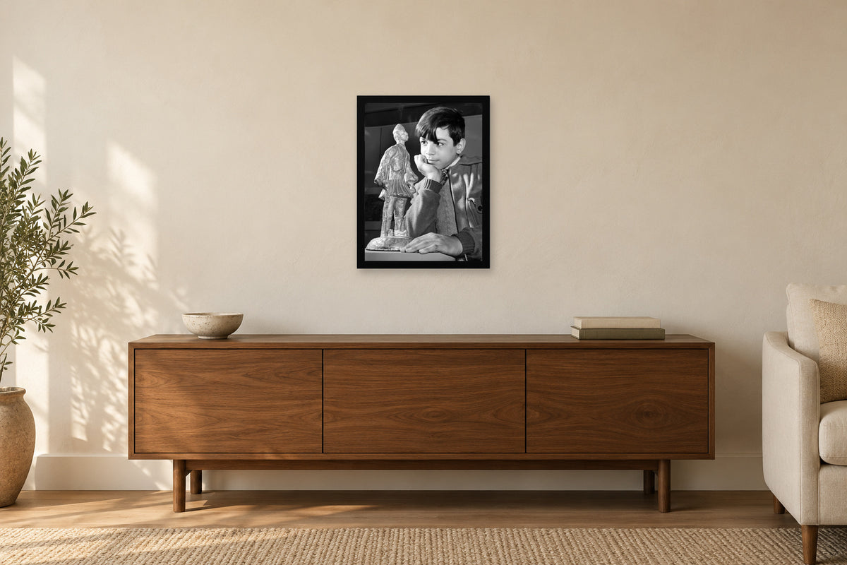 A Child with an Evzone Statuette in a black frame, shown in a home setting — room visualization