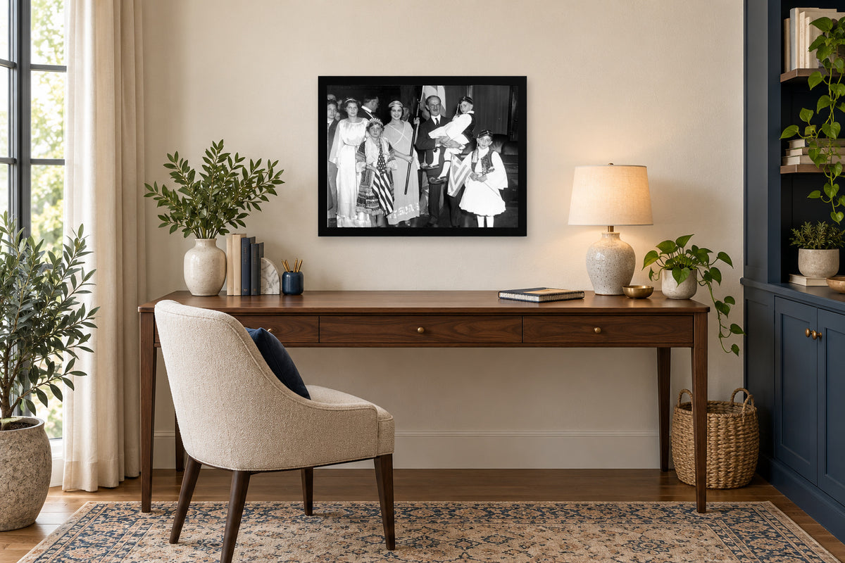Young People in Traditional Dress in a black frame, shown in an office setting — room visualization