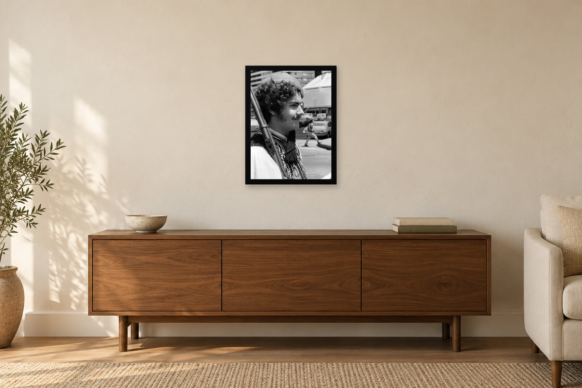 A Young Evzone at the Parade in a black frame, shown in a home setting — room visualization