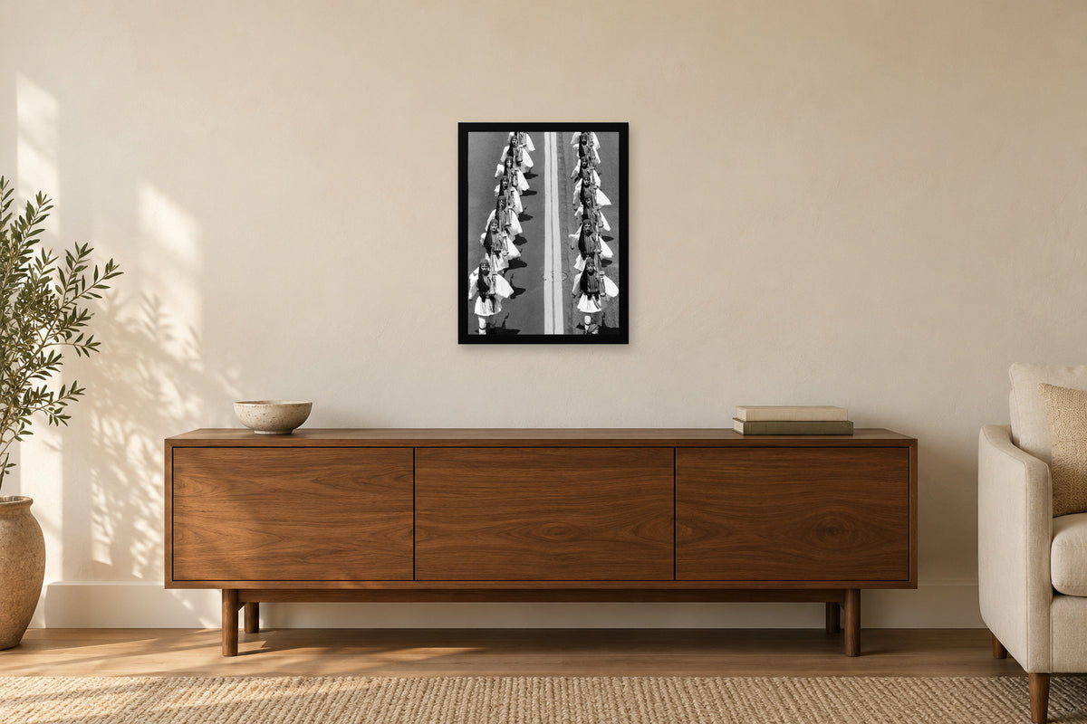 Evzones Seen from above in a black frame, shown in a home setting — room visualization