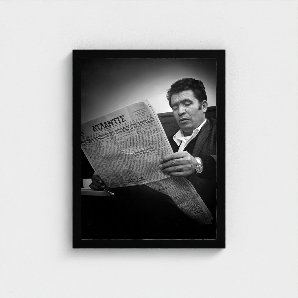 Reading the Greek Newspaper — 12 × 16 inch black framed print