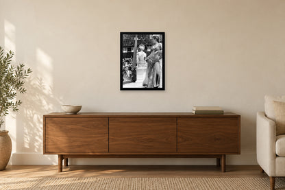 A Performer beside the Festival Stage in a black frame, shown in a home setting — room visualization