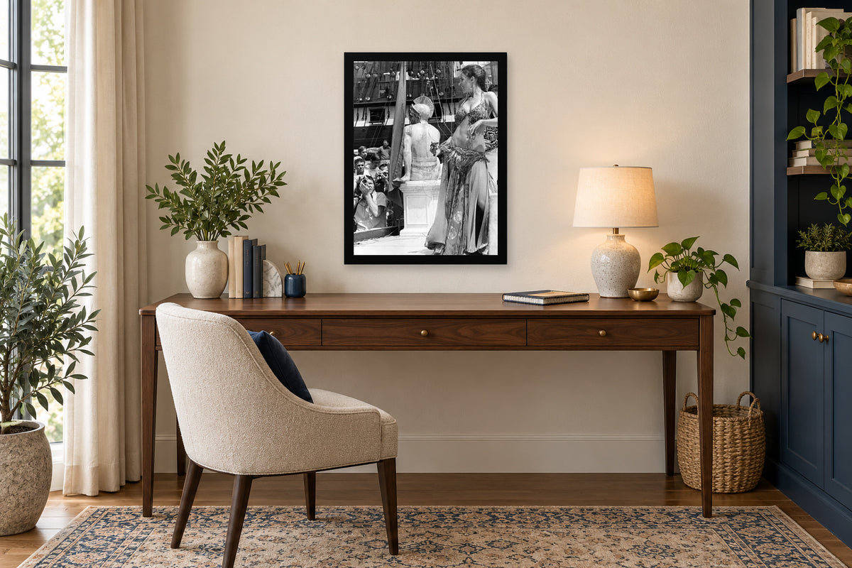 A Performer beside the Festival Stage in a black frame, shown in an office setting — room visualization