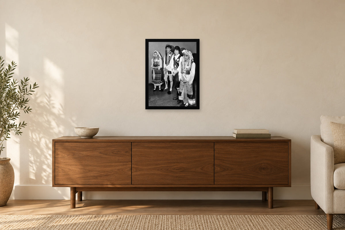 Young People in Traditional Dress in a black frame, shown in a home setting — room visualization