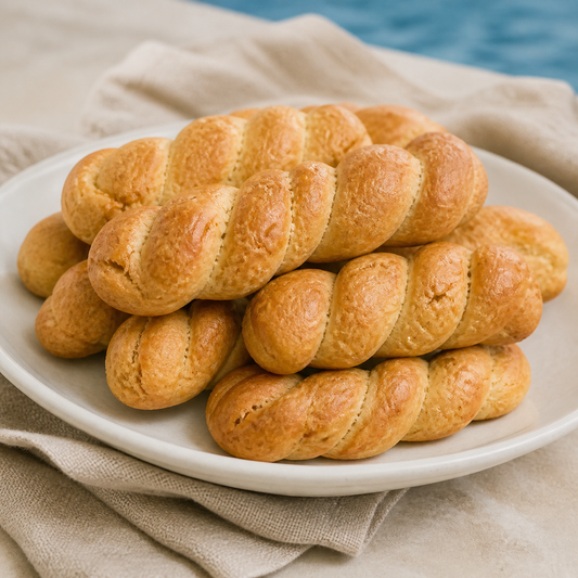 Traditional koulourakia shown on a ceramic plate in a styled serving photograph