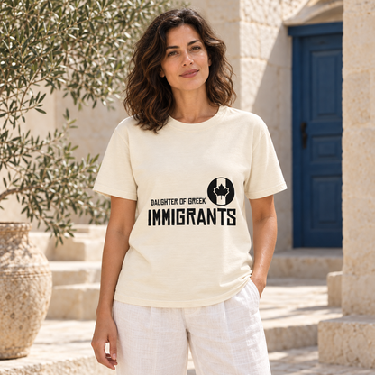 Daughter of Greek Immigrants — Canada — Ivory shirt worn by a model in a sunlit stone courtyard; AI-generated lifestyle mockup
