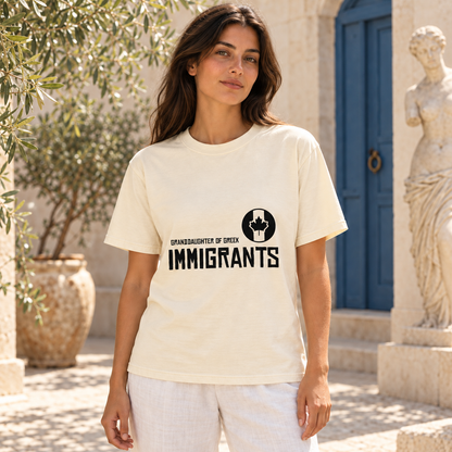 Granddaughter of Greek Immigrants — Canada — Ivory shirt worn by a model in a sunlit stone courtyard; AI-generated lifestyle mockup