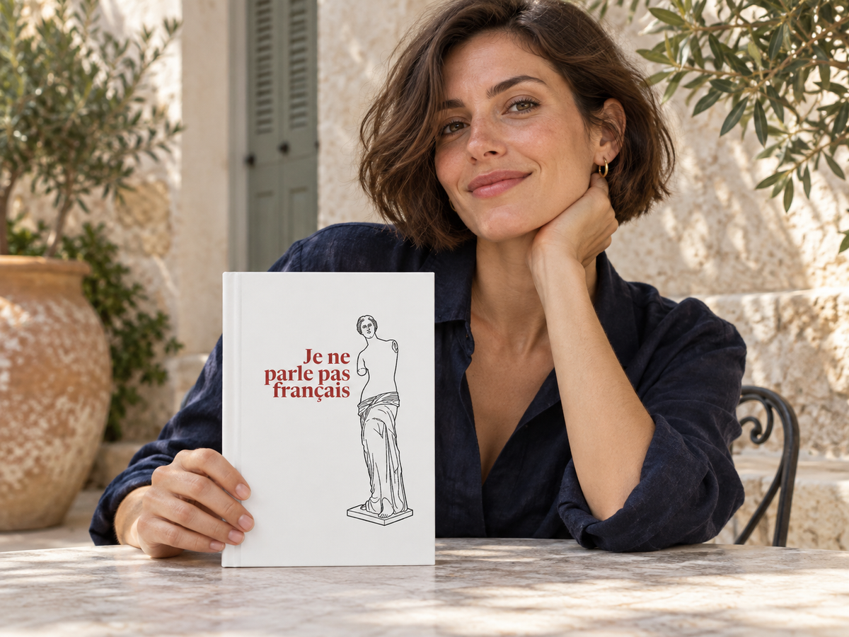 AI-generated lifestyle illustration of a person holding the Venus de Milo — I Don’t Speak French — Matte Hardcover Journal; item sold individually
