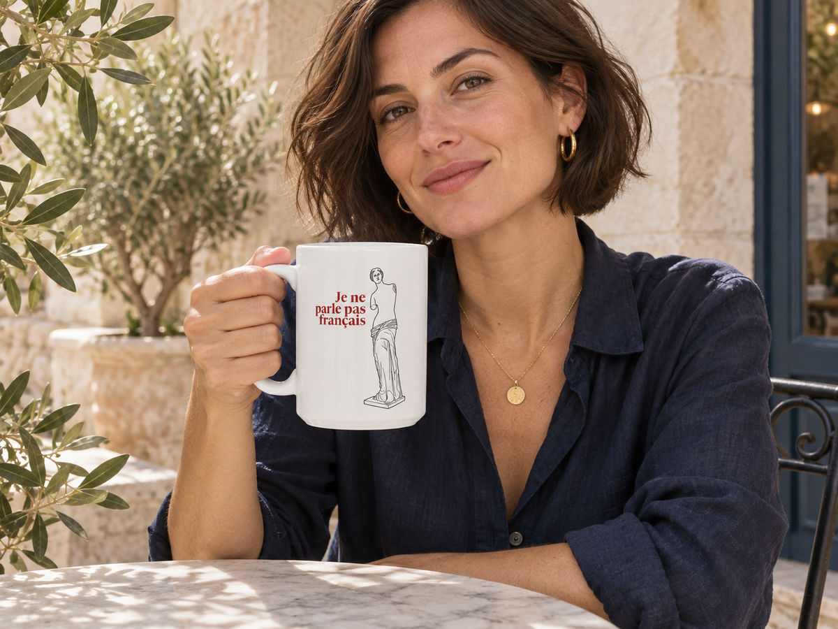 AI-generated lifestyle illustration of a person holding the Venus de Milo — I Don’t Speak French — 15 oz Ceramic Mug; item sold individually